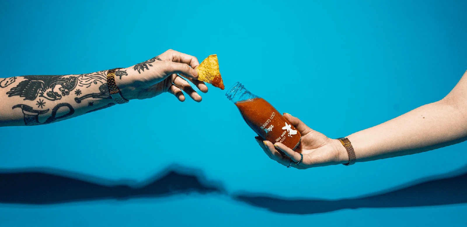 Tortilla chip dipped into Burrito Loco salsa
